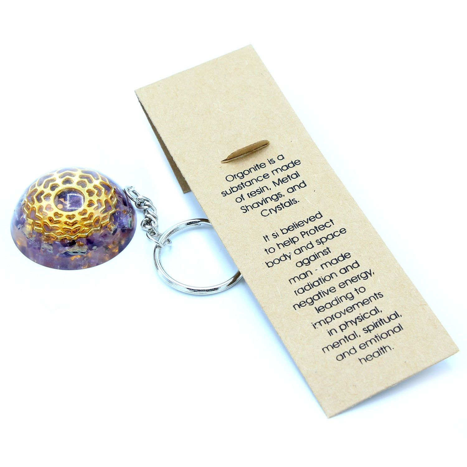 Keychain with hexagonal design and purple substance, accompanied by a card with text on a white background